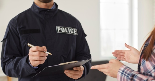 police officer talking to woman